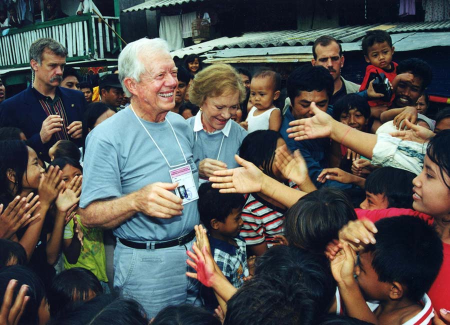 Jimmy and Rosalynn Carter greet Indonesian citizens in 1999.